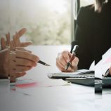 A distorted picture of a tax advisor talking with a private client.